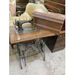 A sewing machine table and stand, with Werkheiam sewing machine in walnut case, on metal stand, the