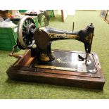 A Singer sewing machine. Note: VAT is payable on the hammer price of this lot at 20%.