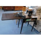 A stained oak cased sewing machine table and stand, with black Singer sewing machine number Y9627653