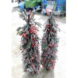 Two artificial Christmas trees, each a white spruce with red berries, in individual plant pots, 130c