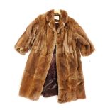 A National Fur Company Ltd fur coat, with a light brown fur finish with a dark brown interior.