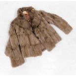 A faux fur half length jacket, in a grey finish with pink interior, unlabelled.