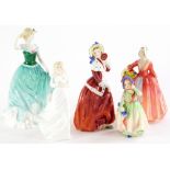 A collection of Royal Doulton porcelain figurines, Emily, Janet, Babie, Loving You and Christmas Mor