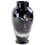 An unusual Victorian black glass vase, decorated in the manner of Mary Gregory with a figure, trees,