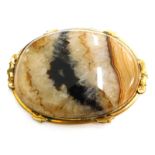 A Blue John set oval brooch, with a scroll design to the border, gold coloured unmarked, 6.5cm x 4.5