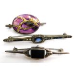 Three bar brooches, to include a silver black onyx Art Deco style bar brooch, a silver plated and pa