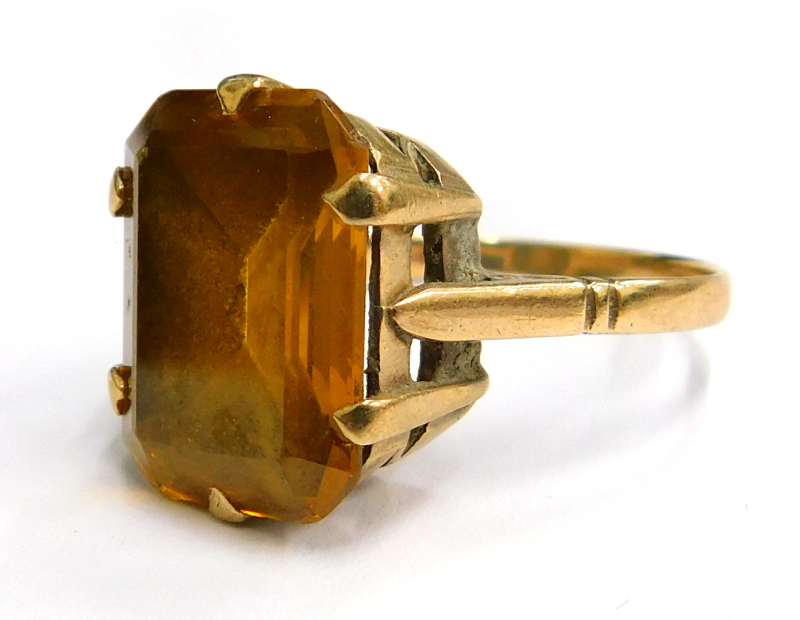 A 9ct gold dress ring, with rectangular citrine stone, in a six claw setting, on a raised shank, wit