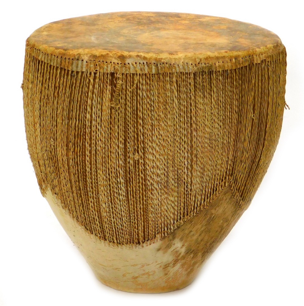 An African hide Tribal drum, 59cm wide, 54cm diameter.