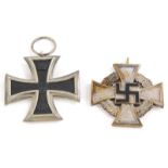 A German Iron Cross WWI service medal, dated 1914, and a WWII German 25 year service medal. (2)