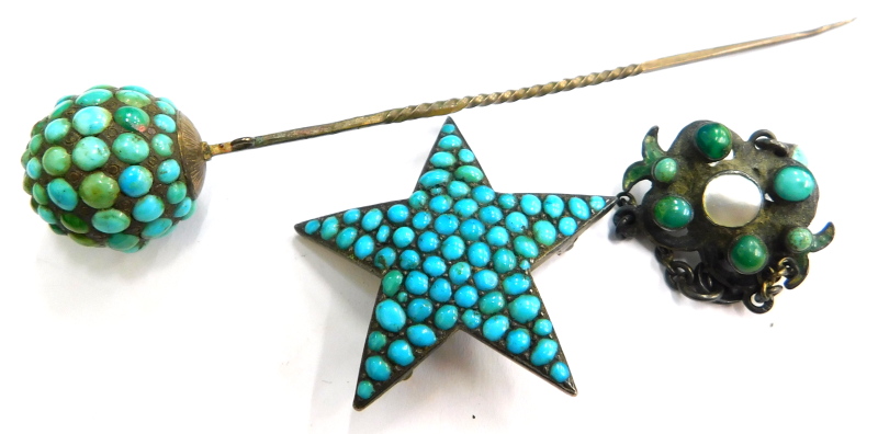 A turquoise set stick pin, a silver enamelled turquoise and a mother of pearl set pendant, and a tu