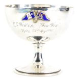 A George V silver goblet shaped trophy cup, applied with enamel flags, initialled L E Weldon, Bow Wo