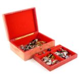A red leather jewellery box and contents, comprising stone set jewellery, cloisonne type bangles, si