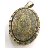 A Victorian memorial locket, with engraved floral design, silver plated with pendant loop, 4.5cm hig