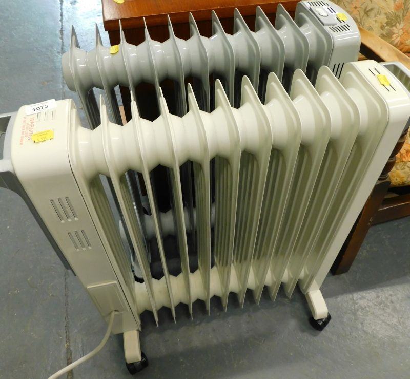 Two oil filled electric heaters, Futura and Blyss.