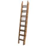 A pair of wooden vintage step ladders, in two parts with shaped rungs.