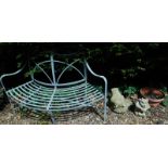 A metal framed two seater garden bench, two garden ornaments etc. (a quantity).