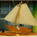 A treen table lamp, formed as a sailing boat, with mast.