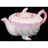 A first period Belleek pink ground Neptune teapot and cover, the coral moulded body sitting on shell