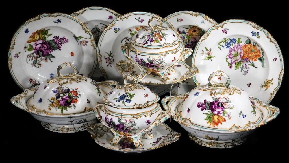 A 19thC continental porcelain part dinner service, each piece profusely decorated with handpainted f