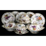 A 19thC continental porcelain part dinner service, each piece profusely decorated with handpainted f