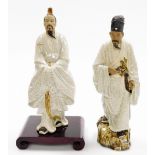 Two Chinese terracotta and white crackle glazed "mudmen" figures, including a figure of a man holdin