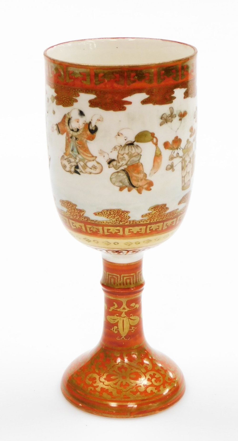 A late 19thC Japanese Kutani goblet, decorated with seated and dancing figures, in Kutani patterning