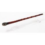 A bamboo opium pipe, with white metal mounts on stand, 51cm long.