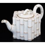 A first period Belleek bamboo moulded teapot and cover, black first period mark, the moulded body in