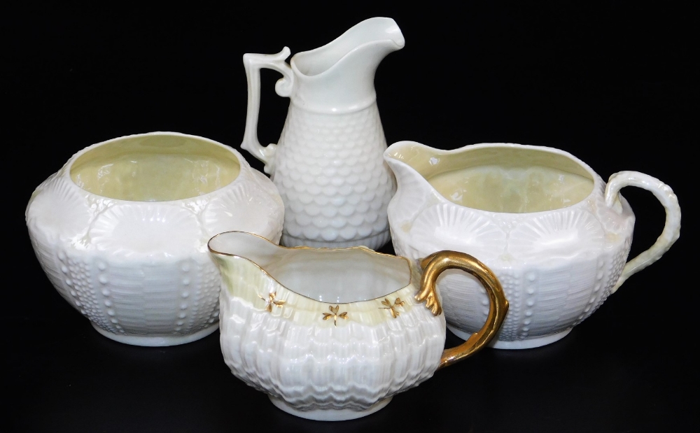 A group of first green mark Belleek wares, comprising of Tridacna creamer with yellow band and gilt