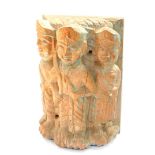 An antique Indian wooden totem carving, with three standing figures on a floral and foliate scroll b