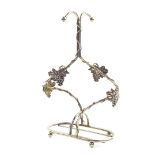 A vintage French Silea silver plated twin wine bottle holder, of scrolling vine form, 33cm high.