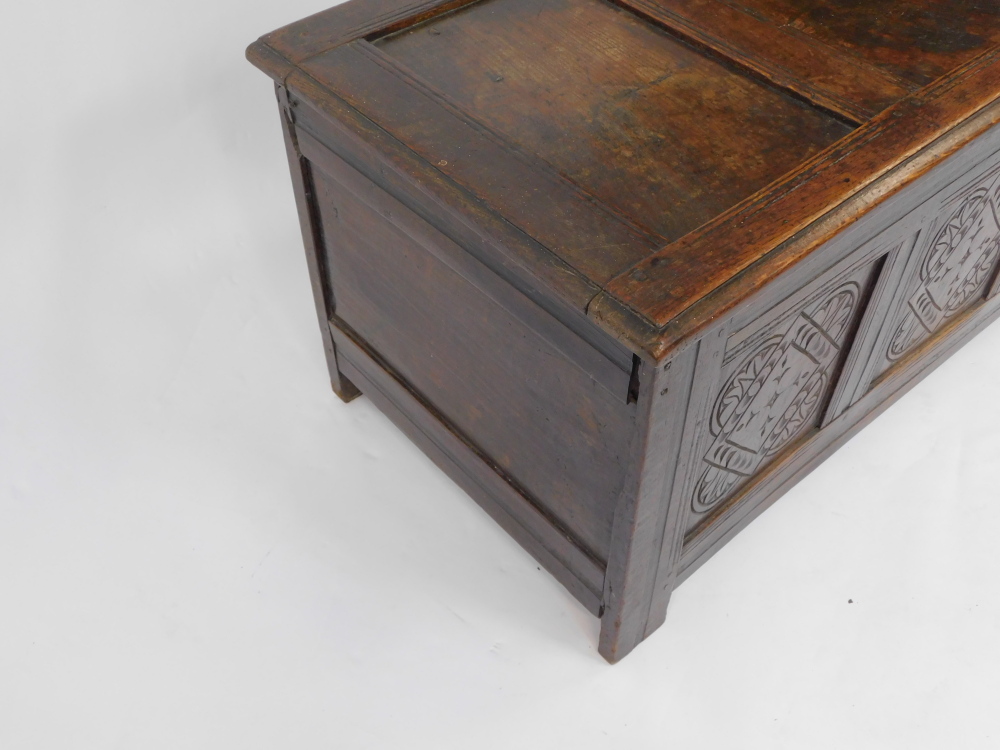 An 17thC oak blanket box, with a carved triple panelled front, raised on channeled square legs, 55cm - Image 4 of 6