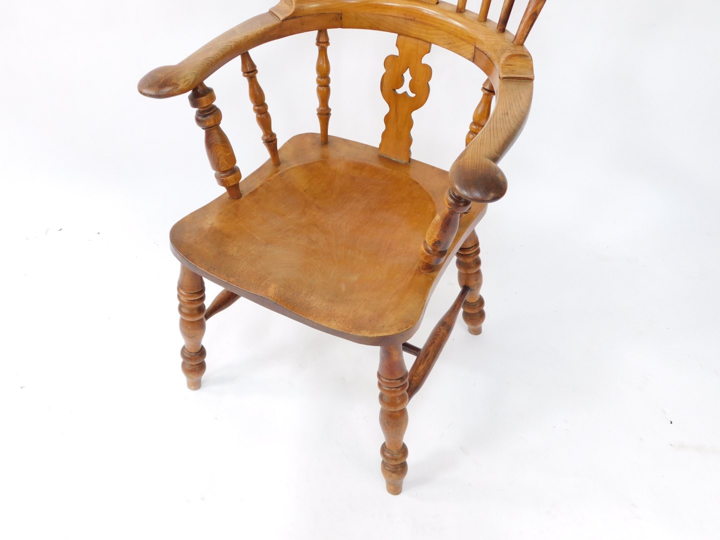 A Victorian oak yew and beech Windsor chair, solid saddle seat raised on turned legs, united by an H - Image 3 of 3