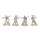 A set of four Edward VII silver menu holders, two cast as Scottish Dancers, the other two cast as ba