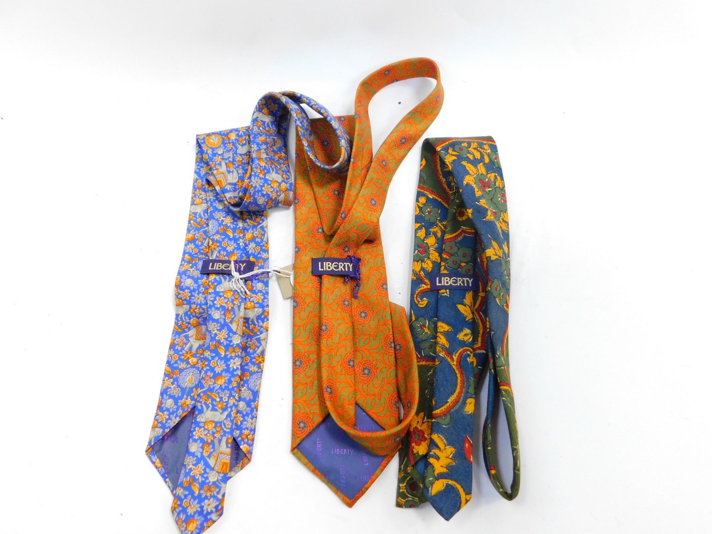 A Liberty blue silk tie, with Indian inspired decoration of animals and flowers, orange and green fl - Image 2 of 2