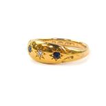 An 18ct gold sapphire and diamond three stone gypsy ring, size P/Q, 3.5g.