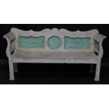 An Anglo Indian late 19thC three seater bench, with scroll arms, painted in white and mint green, ra