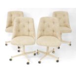 A set of four American late 20thC swivel single dining chairs, upholstered in button back oatmeal fa