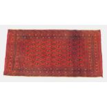 A Turkoman saddle bag rug, with multi borders and multi gull centre field, 134cm x 68cm.