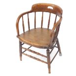 A Victorian oak captain's chair, with a screw down solid seat, raised on turned legs united by turne