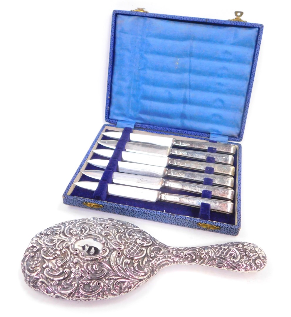 A set of six George VI silver handled fruit knives, cased, Sheffield 1946, and an Edward VII silver