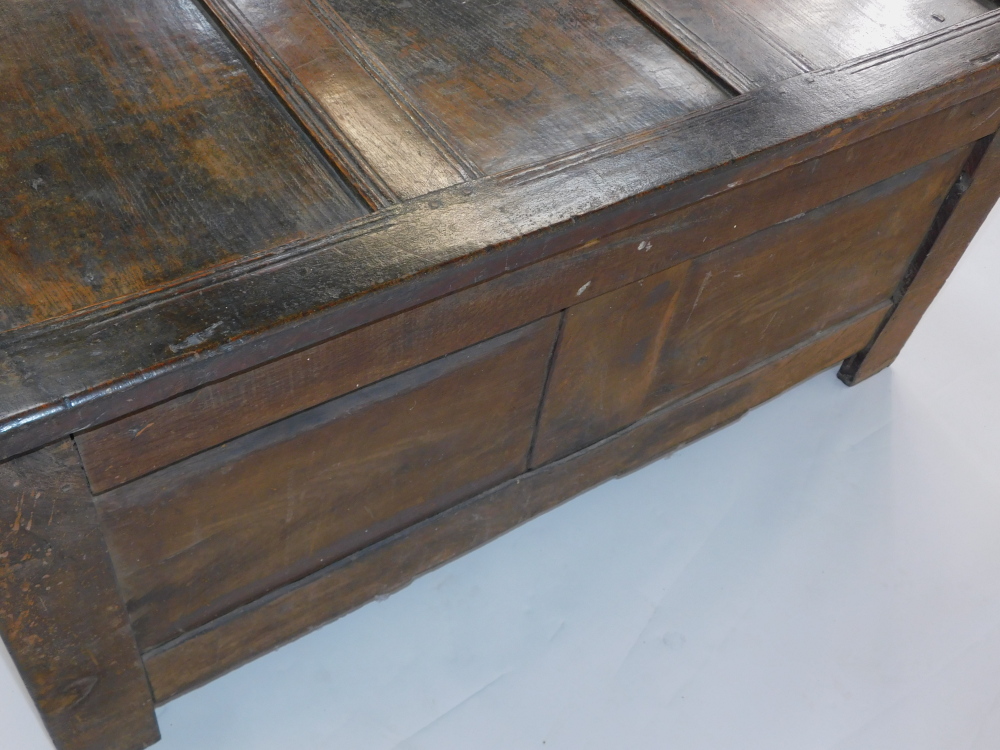 An 17thC oak blanket box, with a carved triple panelled front, raised on channeled square legs, 55cm - Image 5 of 6