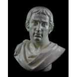 A white glazed pottery bust of Julius Caesar, 44cm high.