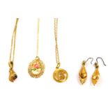 A 9ct gold circular pendant on chain, 9ct gold and sapphire pendant, formed as a hand holding a bud,