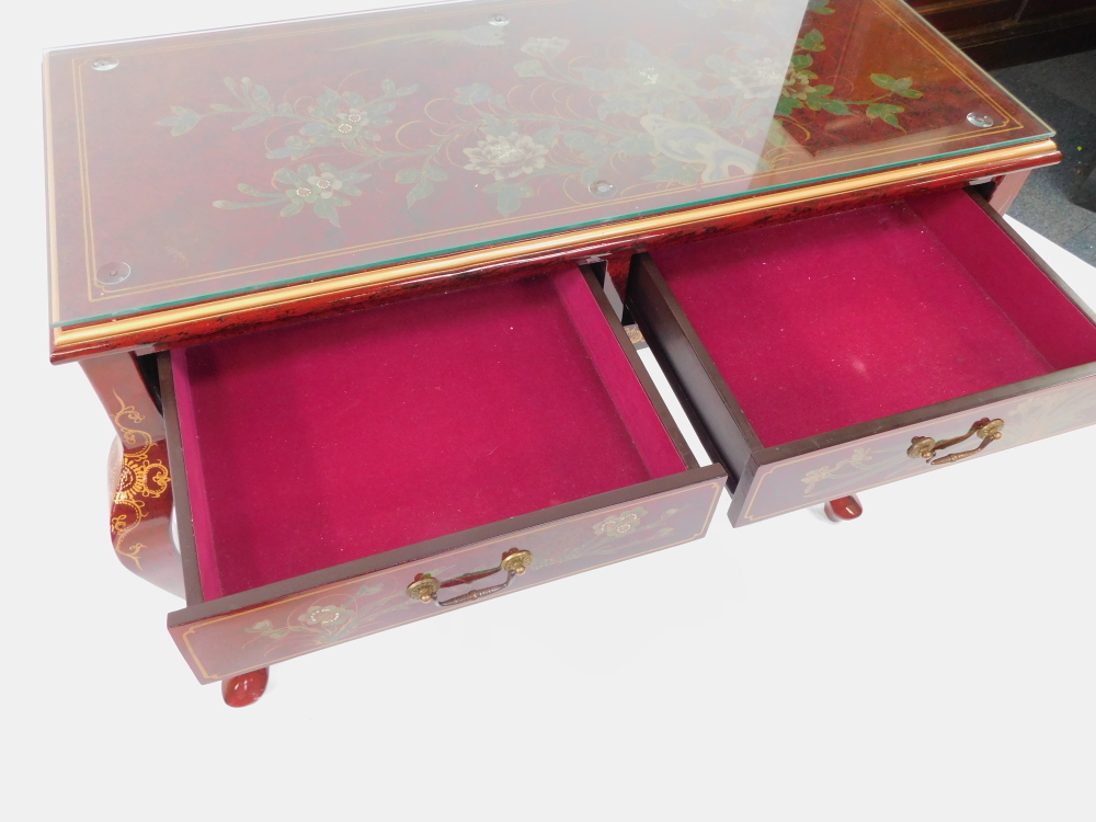 A Chinese painted red lacquer side table, decorated with flowers, with two frieze drawers raised on - Image 4 of 4