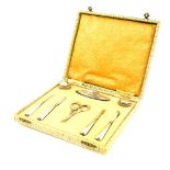 A Continental eight piece manicure set, white metal and cut glass, stamped 830, comprising a pair of