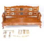 An Indian mid century mango wood swing sofa come daybed, the open and panelled back set with mirrors