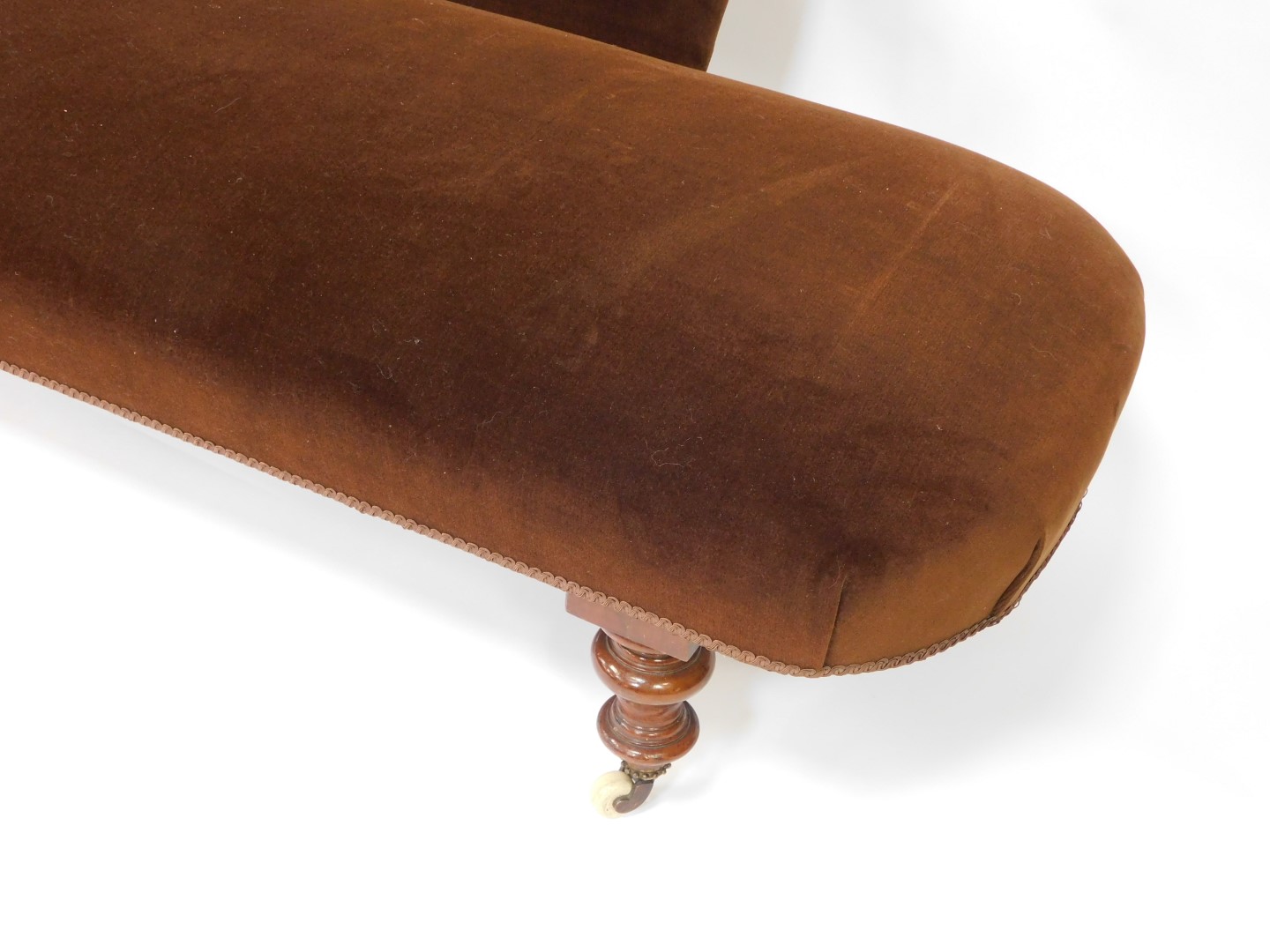A Victorian mahogany chaise longue, upholstered in brown velour, raised on turned legs, brass capped - Image 4 of 4