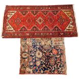 A Shiraz runner, red ground decorated with five lozenges, floral and other motifs, 190cm x 103cm , t