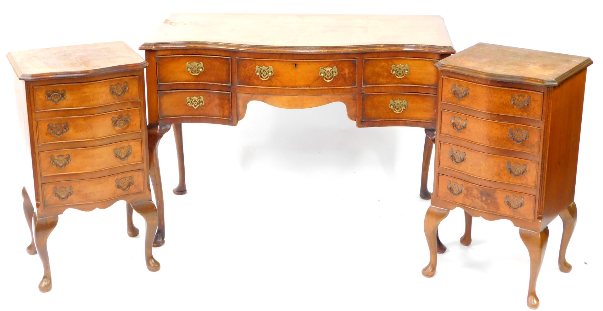 A 20thC mahogany and burr walnut serpentine part bedroom suite, comprising a dressing table, one lon